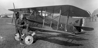 American ace Eddie Rickenbacker with his SPAD S.XIII. Note the Hat-in-the-Ring squadron logo on the side of the fuselage (US Air Force)